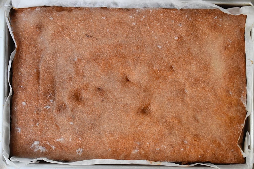 Whole Lemon Drizzle Traybake in a traybake tin.